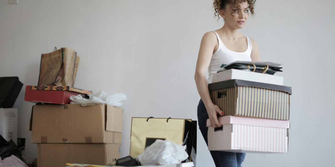 Girl decluttering paper and boxes